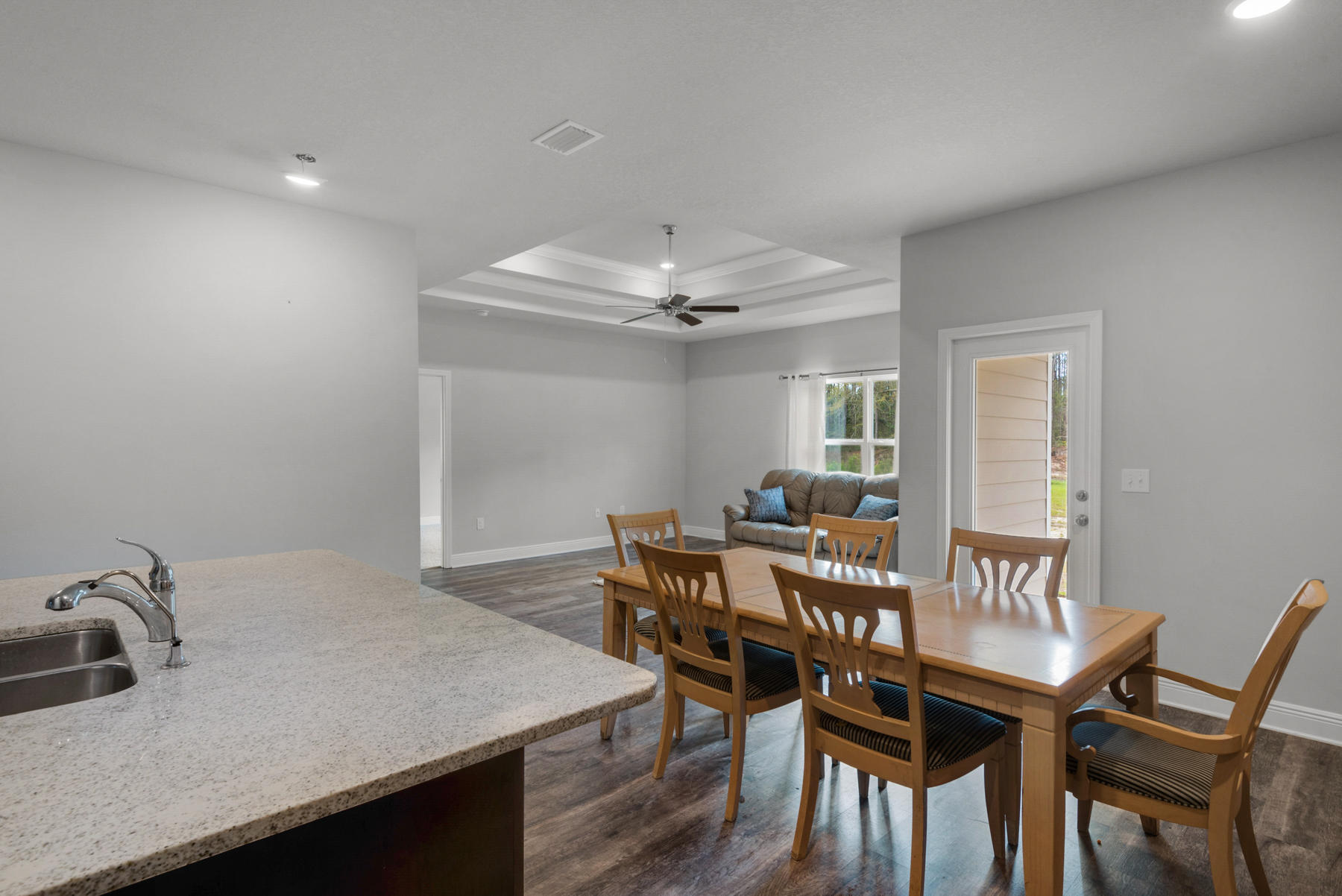 214 Southern Pines Road Santa Rosa Beach, FL 32459 - Photo 9 of 27 a view of a dining room with furniture and wooden floor