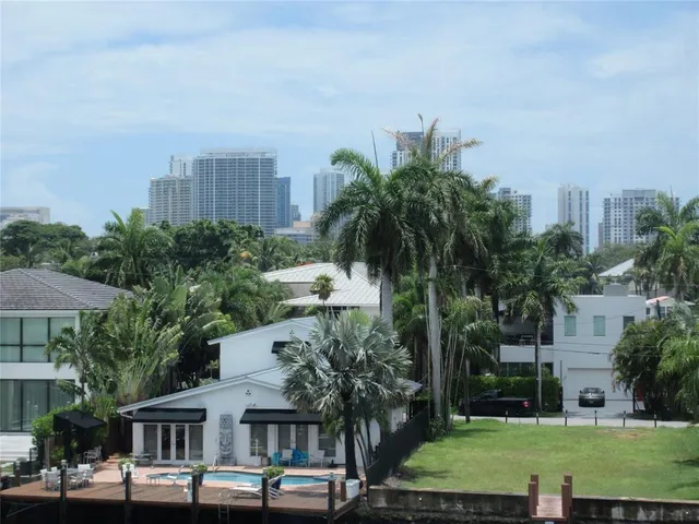 a view of a chandelier and glass door