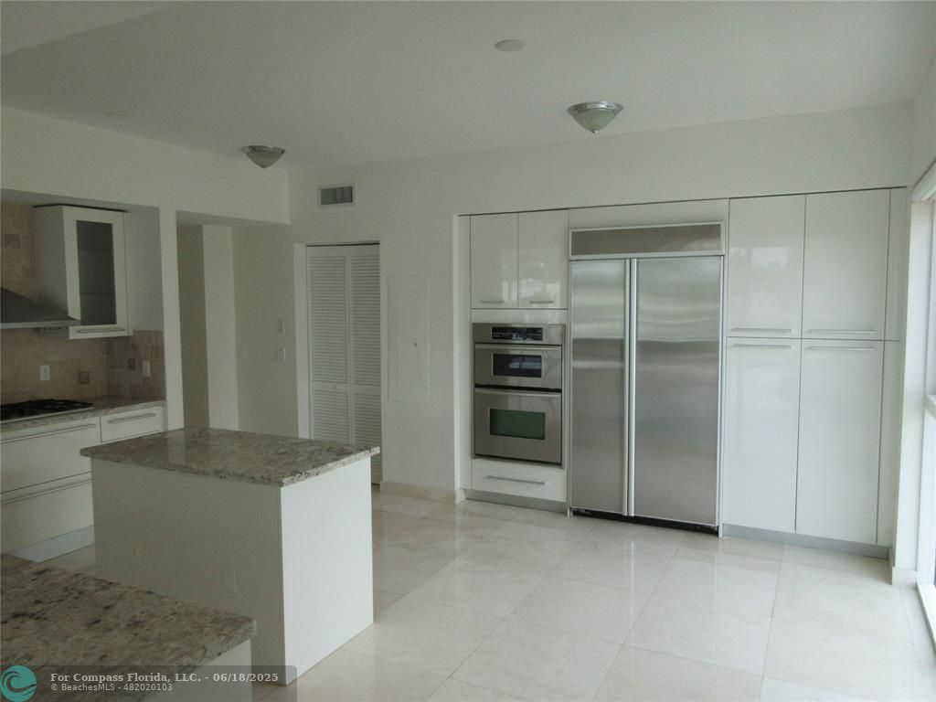 45 Hendricks Isle, Unit 301 Fort Lauderdale, FL 33301 - Photo 16 of 26 a view of an empty room with a fireplace