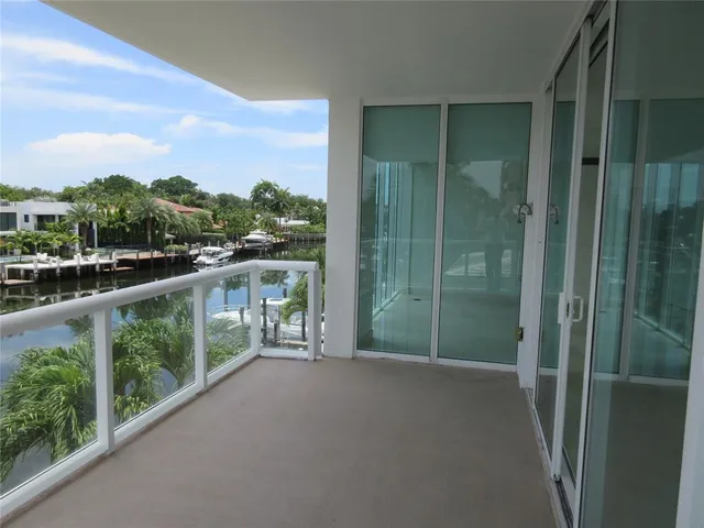 a view of a lake with boats next to a bridge