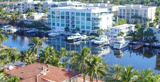 a front view of a residential apartment building with a yard