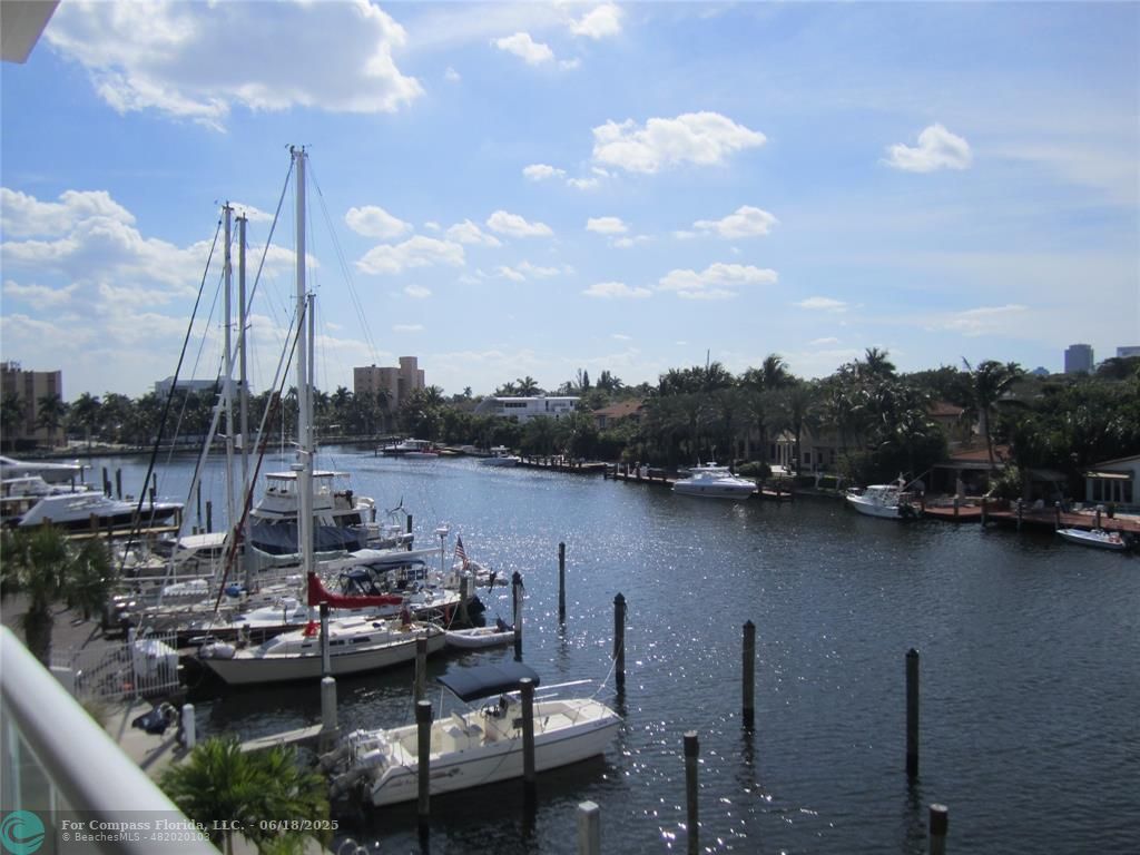 45 Hendricks Isle, Unit 301 Fort Lauderdale, FL 33301 - Photo 4 of 26 a view of a lake with boats next to a bridge