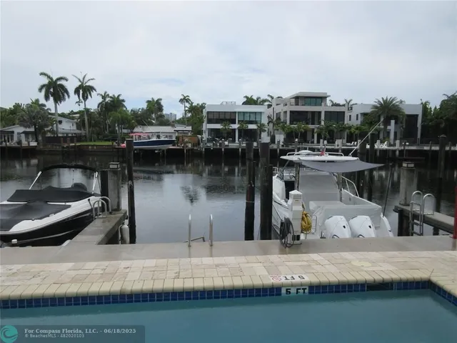 a view of a swimming pool with a lounge chair
