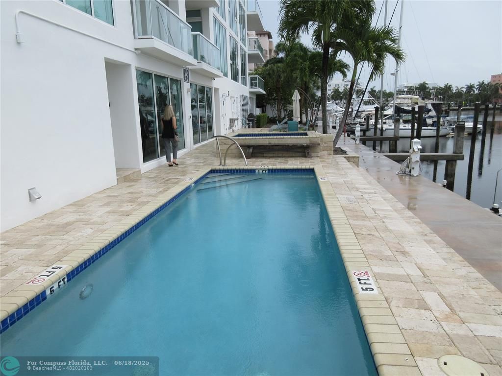 45 Hendricks Isle, Unit 301 Fort Lauderdale, FL 33301 - Photo 9 of 26 a view of a swimming pool with a lounge chair