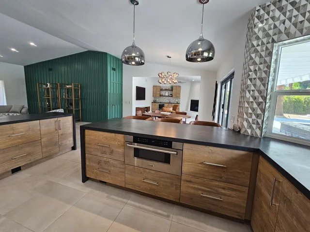 a spacious bedroom with a large bed and a large window