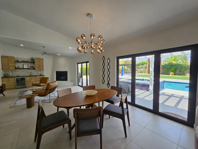 a bedroom with a large bed and a flat screen tv
