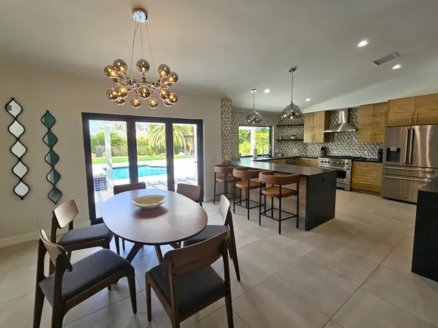 a bathroom with a sink a mirror and a shower