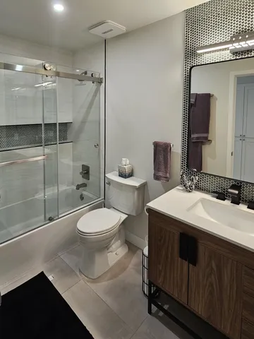 a view of a house with a backyard porch and sitting area