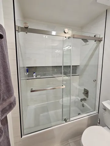 a view of a patio with a table chairs and a yard