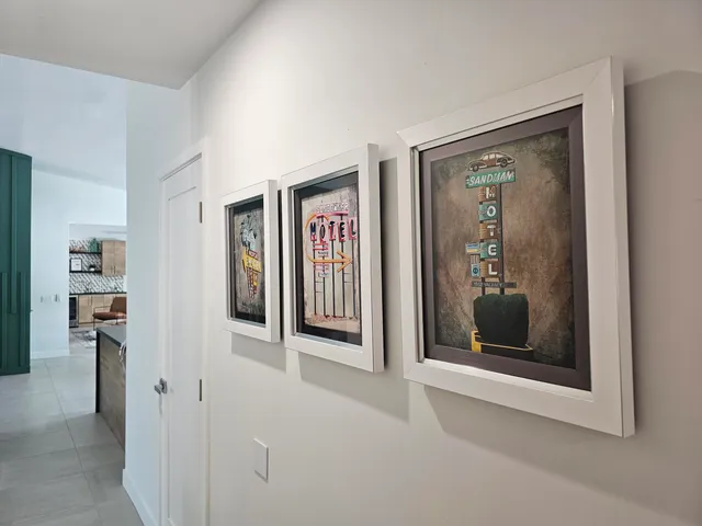 a view of a table and chairs under an umbrella