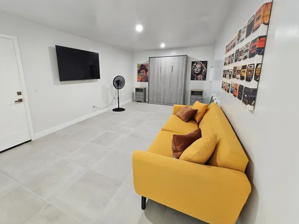 a view of a table and chairs under an umbrella