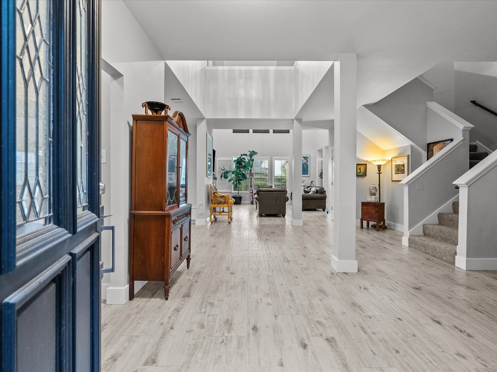 2965 Rustic Pier Lane League City, TX 77573 - Photo 5 of 50 Entry w/ porcelain plank flooring, open to formal dining, library and amazing custom chandelier.