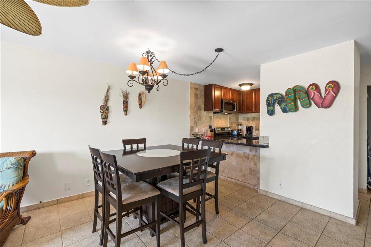 4909 Lower Honoapiilani Road, Unit E2E Lahaina, HI 96761 - Photo 19 of 42 a view of a dining room with furniture