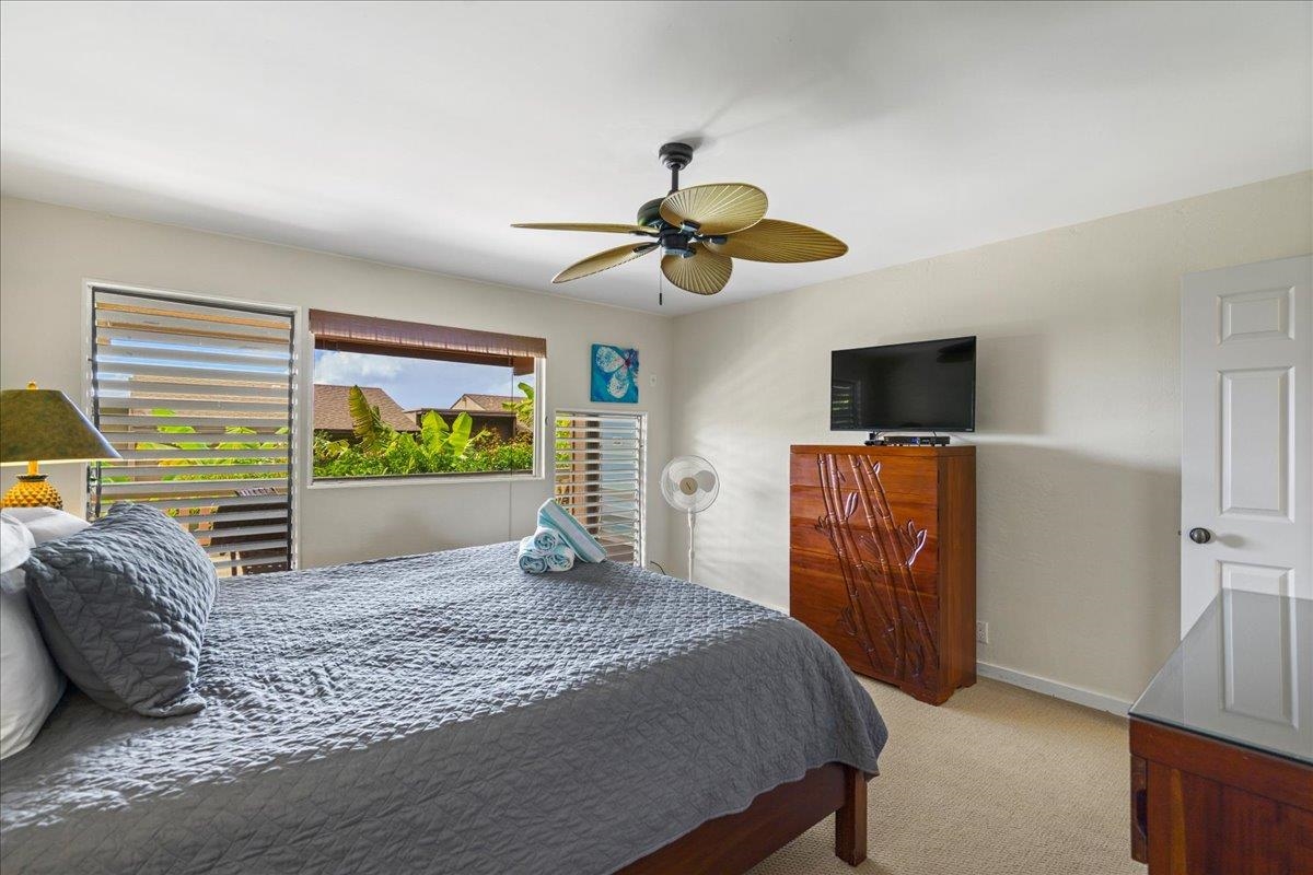 4909 Lower Honoapiilani Road, Unit E2E Lahaina, HI 96761 - Photo 25 of 42 a living room with furniture and a flat screen tv