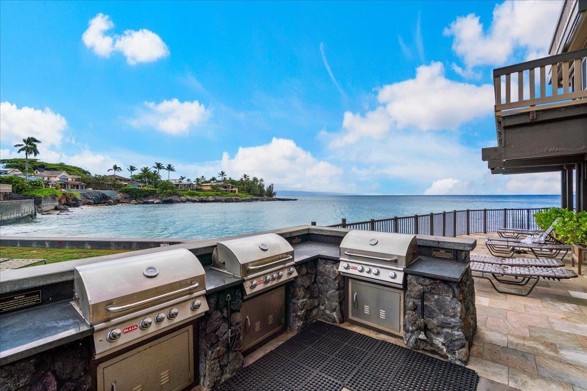 4909 Lower Honoapiilani Road, Unit E2E Lahaina, HI 96761 - Photo 34 of 42 a view of a chairs and table in the terrace