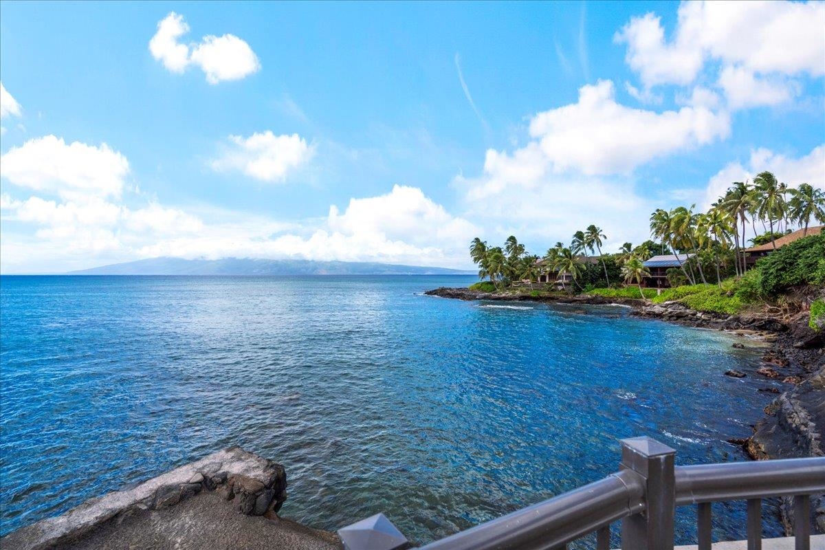 4909 Lower Honoapiilani Road, Unit E2E Lahaina, HI 96761 - Photo 36 of 42 a view of a lake from a yard