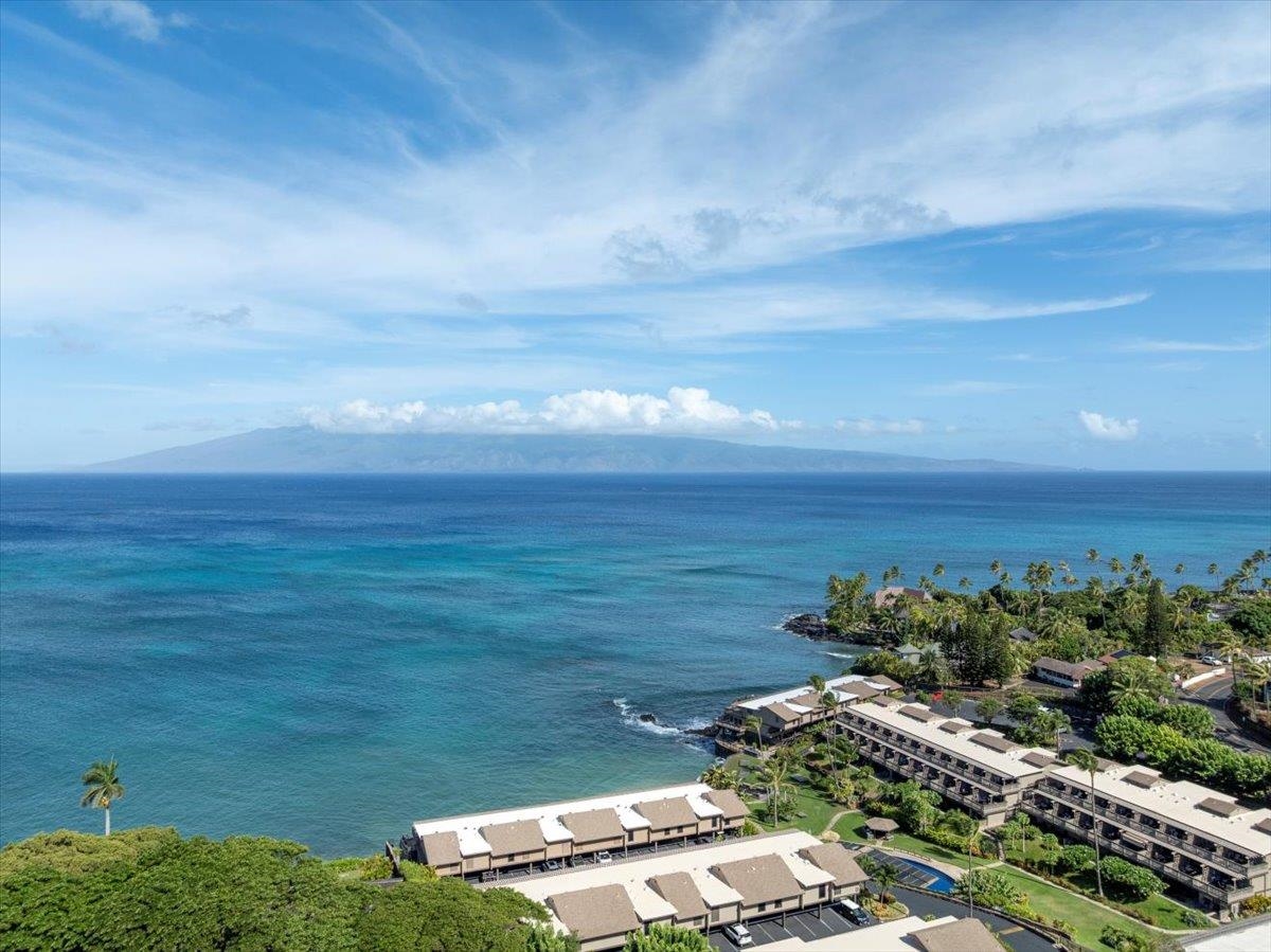 4909 Lower Honoapiilani Road, Unit E2E Lahaina, HI 96761 - Photo 38 of 42 a view of a lake with lawn chairs
