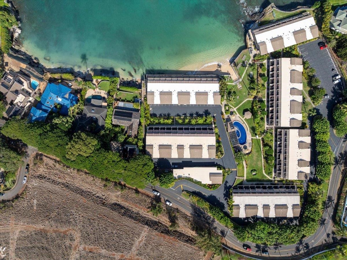 4909 Lower Honoapiilani Road, Unit E2E Lahaina, HI 96761 - Photo 4 of 42 an aerial view of a house with a garden and plants