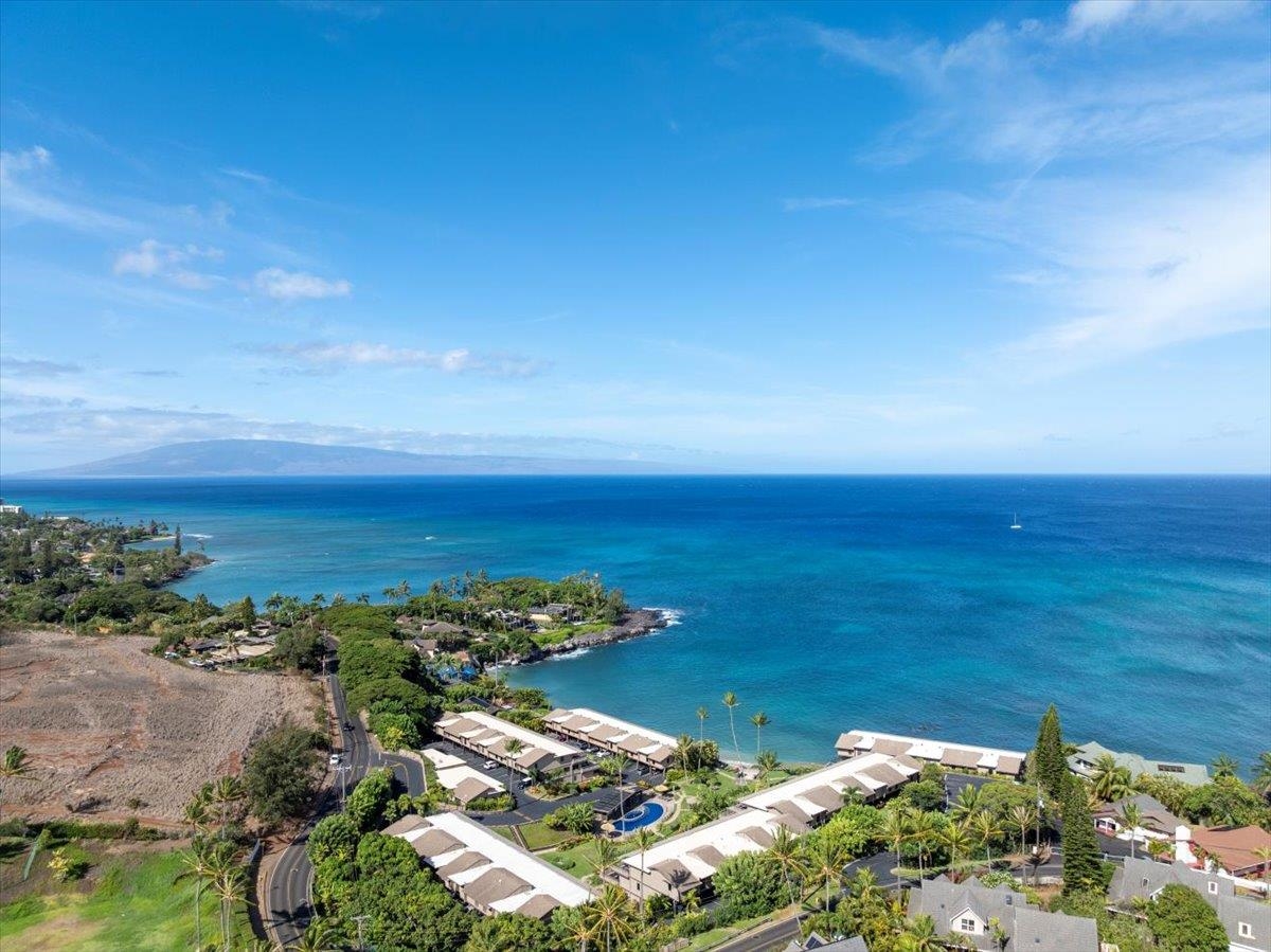 4909 Lower Honoapiilani Road, Unit E2E Lahaina, HI 96761 - Photo 42 of 42 an aerial view of ocean and residential houses with outdoor space