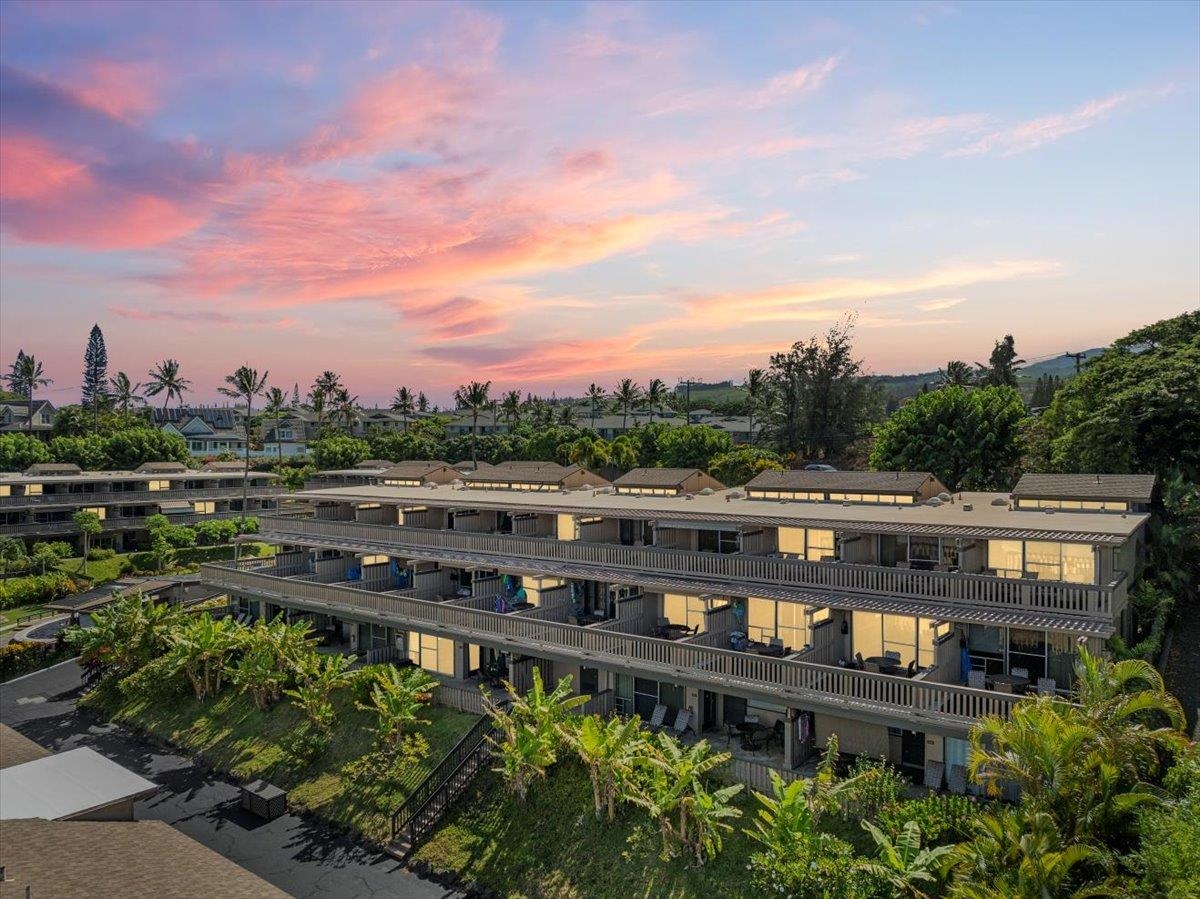4909 Lower Honoapiilani Road, Unit E2E Lahaina, HI 96761 - Photo 5 of 42 a view of a swimming pool with outdoor seating and plants