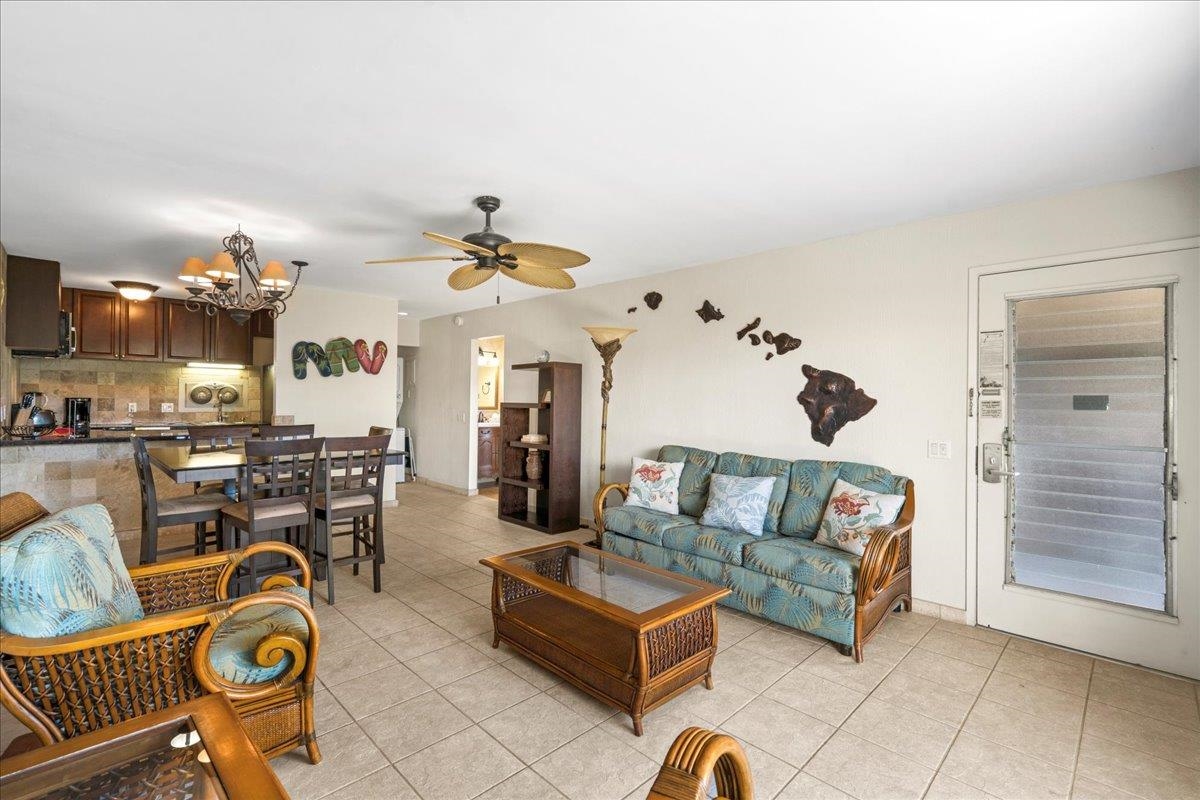 4909 Lower Honoapiilani Road, Unit E2E Lahaina, HI 96761 - Photo 7 of 42 a living room with furniture a rug and white walls