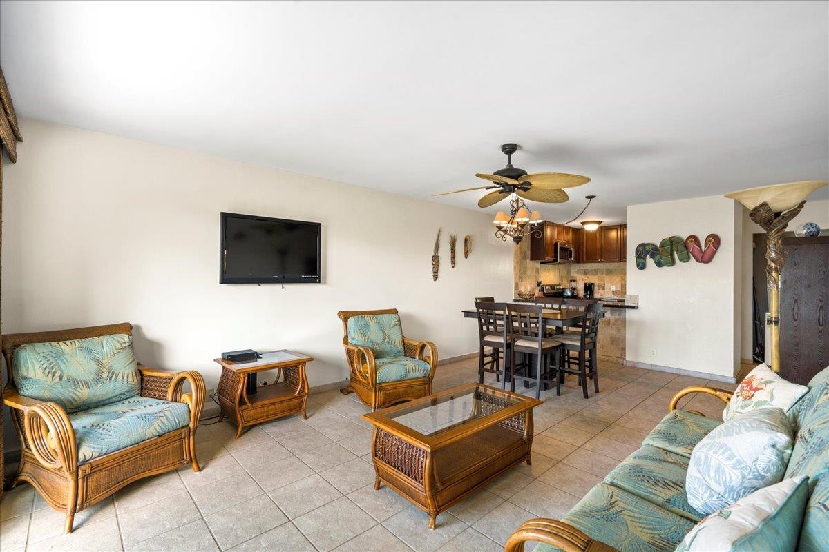 4909 Lower Honoapiilani Road, Unit E2E Lahaina, HI 96761 - Photo 9 of 42 a living room with furniture and a flat screen tv