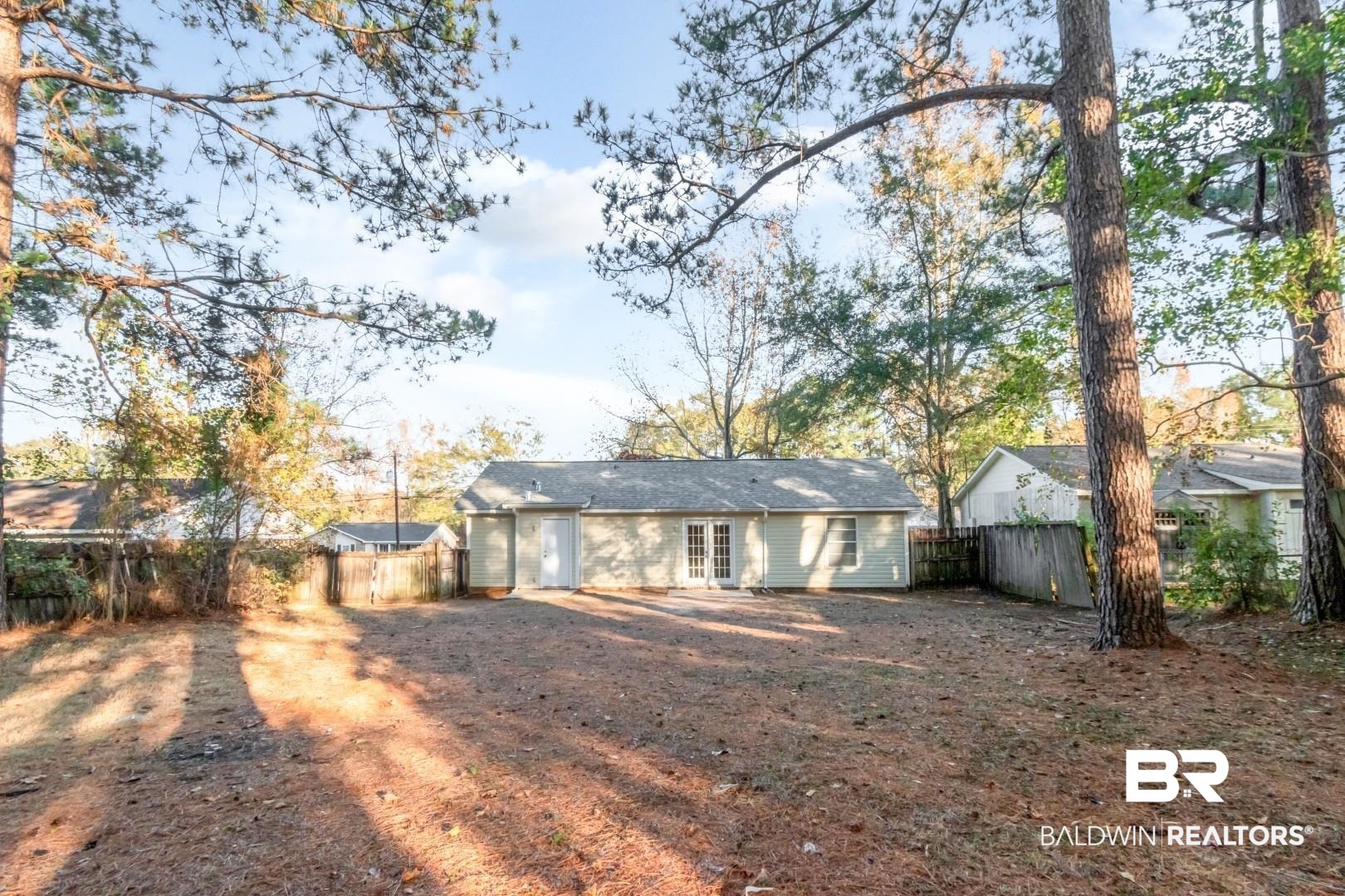 790 Hale Road Mobile, AL 36608 - Photo 21 of 23 Rear view of property with a fenced backyard and french doors