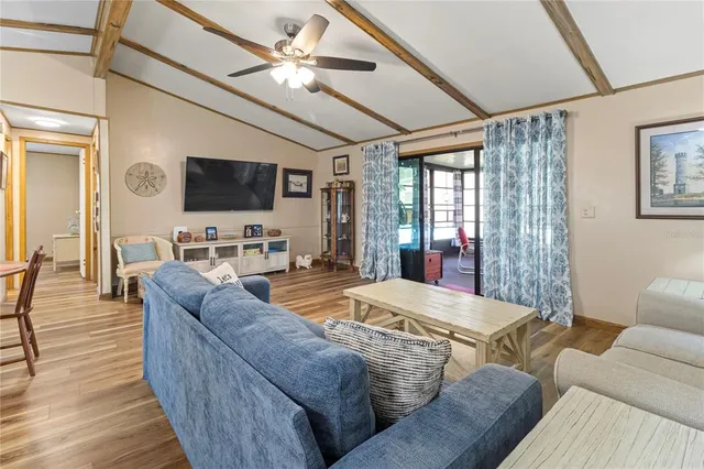 a outdoor dining space with furniture and wooden floor