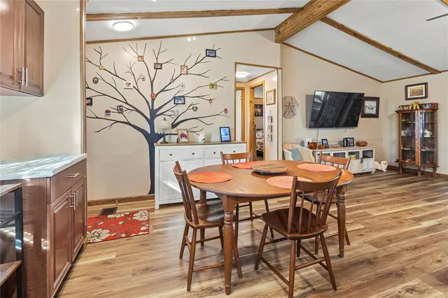 a spacious bathroom with a granite countertop sink and a mirror