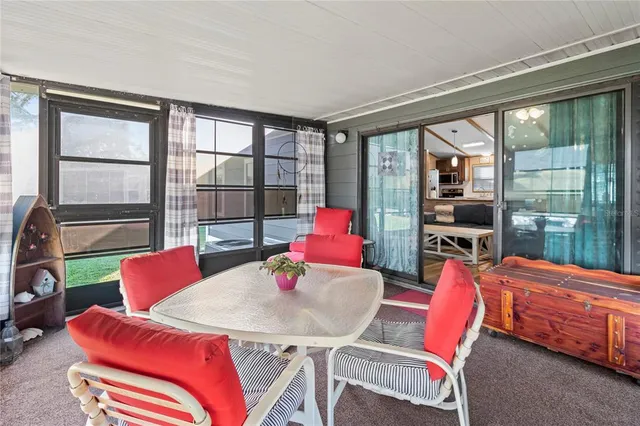 a spacious bedroom with a bed and a chandelier
