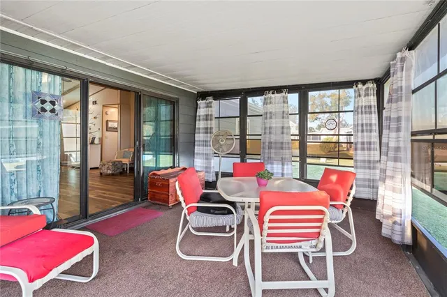 a bedroom with a bed and a flat tv screen on dresser