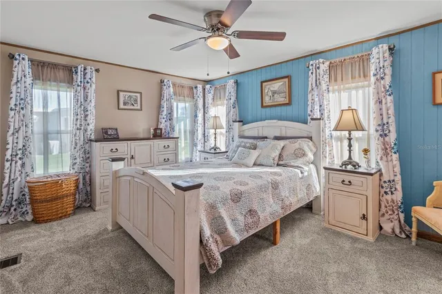 a bedroom with a large bed and a window