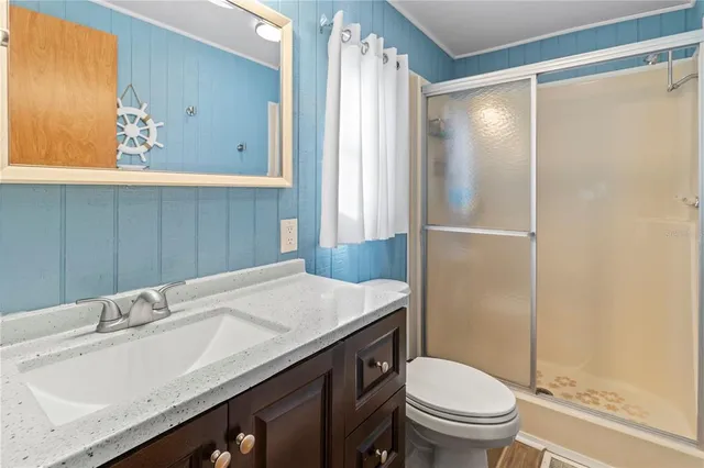 a bedroom with a bed and a television