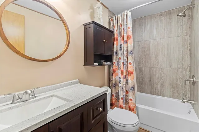 a view of a porch with furniture and garden