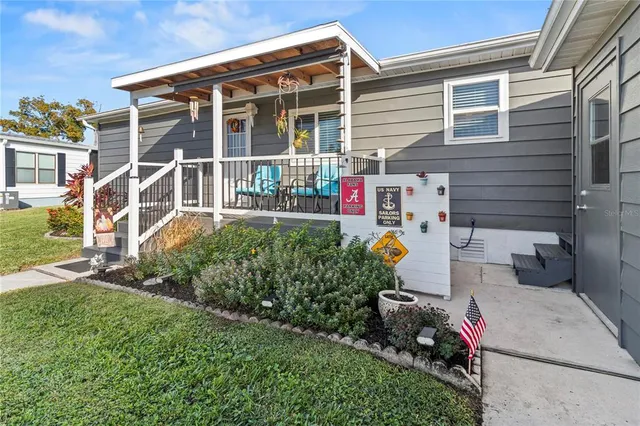 a front view of a house with outdoor seating