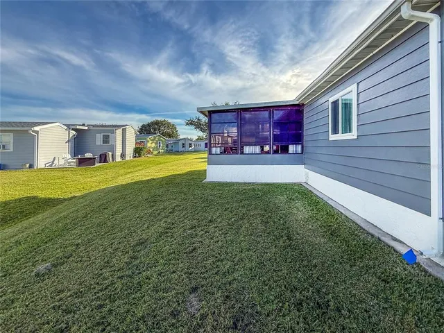 a group of people sitting at kitchen in a building