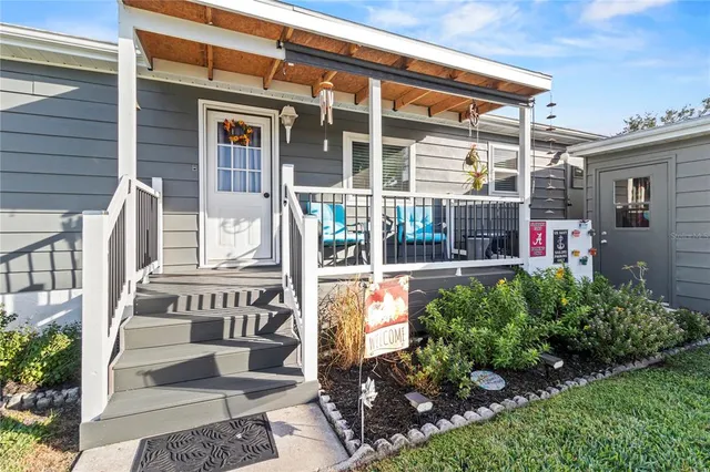 a view of a chairs and table in the balcony