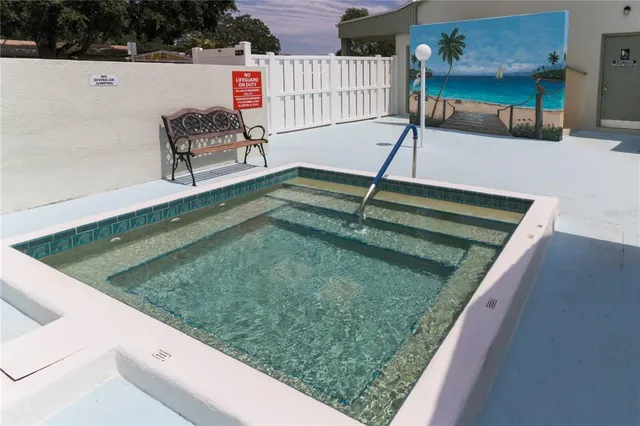a view of a swimming pool with a patio