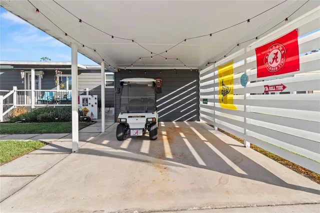 a living room with furniture a wooden floor and a chandelier
