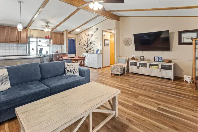 a dining room with furniture and wooden floor
