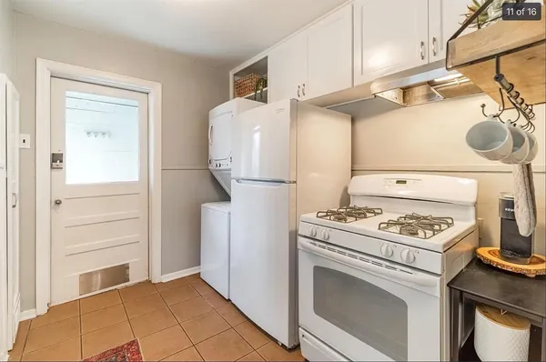 a kitchen with a stove and a refrigerator