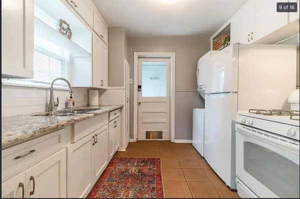 a kitchen with a sink stove and refrigerator