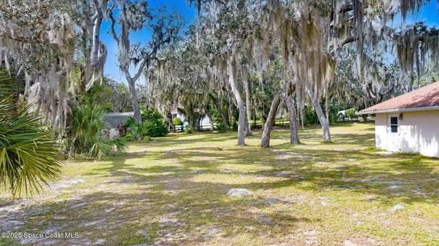 a house with trees in the background