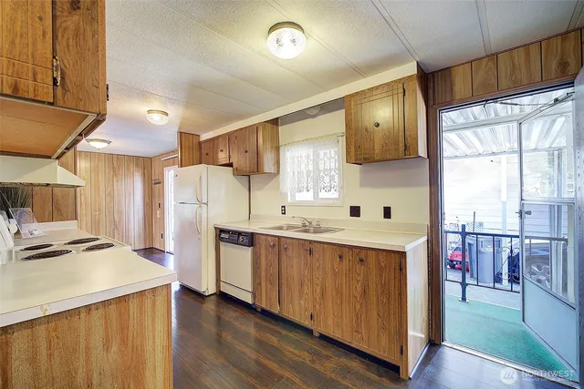 a bathroom with a tub and a view of bathroom