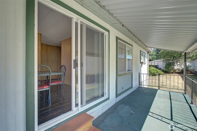 a view of a room with furniture window and wooden floor