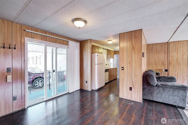 a kitchen with a stove a refrigerator and a sink