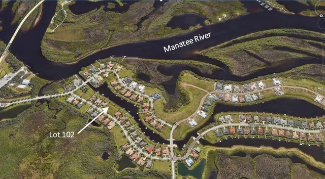 an aerial view of a house with a ocean view