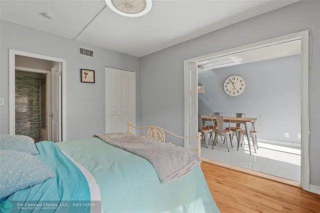 a bedroom with a bed and a table with chair