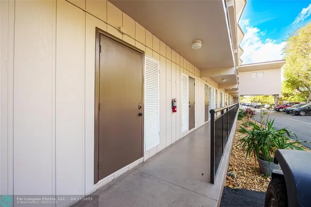 a view of a building with a yard