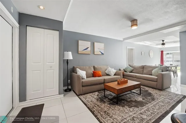 a living room with furniture and a rug